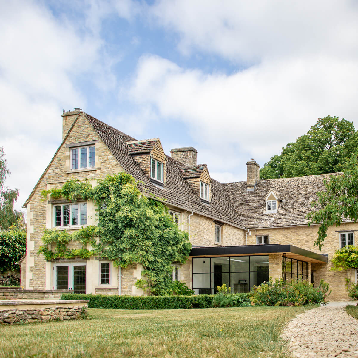 A comprehensive renovation of a Grade II listed Cotswold cottage, blending period charm with contemporary refinement across three stunning floors.